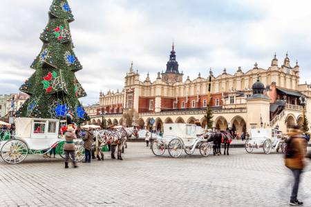 Fair in KRAKOW. Main Market Square and Sukiennice in the evening.